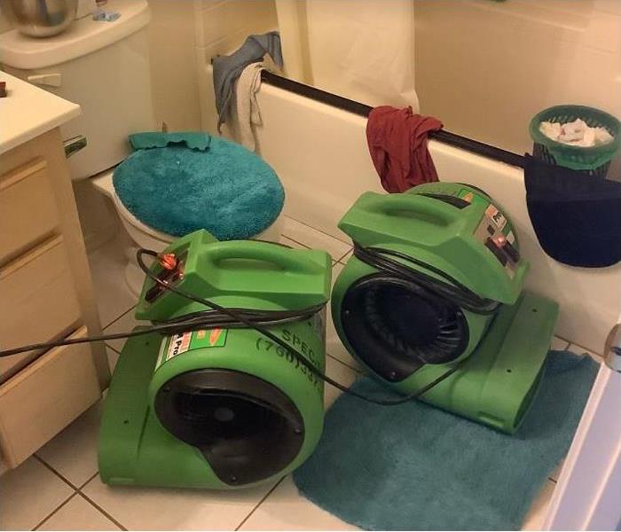 SERVPRO restoration equipoment being used in water damaged bathrooms
