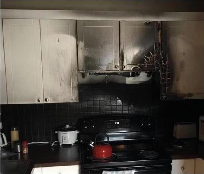 A burnt kitchen stovetop after a fire