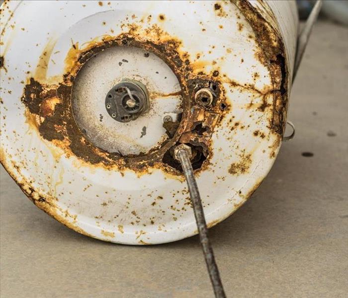 white rusty water heater damaged