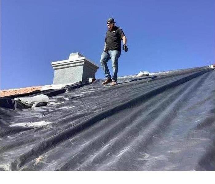 Roof tarp to prevent water damage